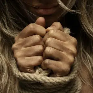 close up photo of woman with her hands tied with rope